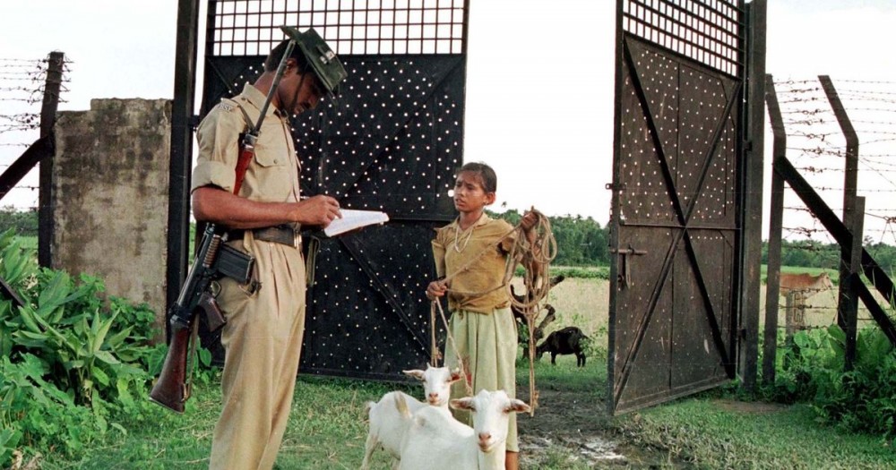 A Border Security Force guard at a checkpoint on the India-Bangladesh border in Assam verifies the name of a girl who went to graze her goats on the other side. (Reuters File Photo)